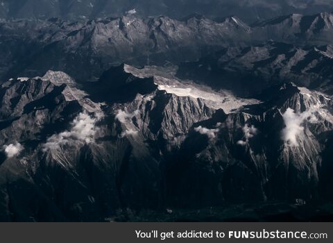 The Swiss Alps on a summer morning from the plane