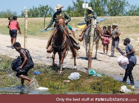 Texas Border Patrol agents rounding up a Haitian refugees