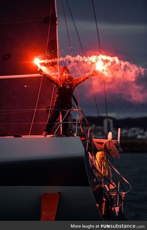 Cole Brauer celebrates becoming the first American woman to sail solo around the world