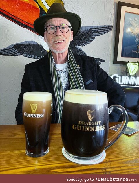 A man enjoying some Guinness