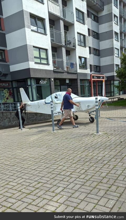 Just a guy pulling his private plane out of an underground parking of an apartment block