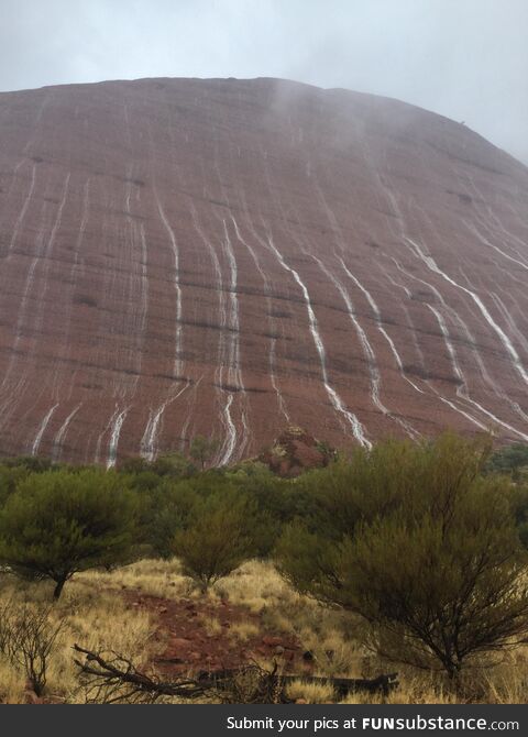 Waterfalls on Uluru, Australia, in one of the rare occurrences in which it rains