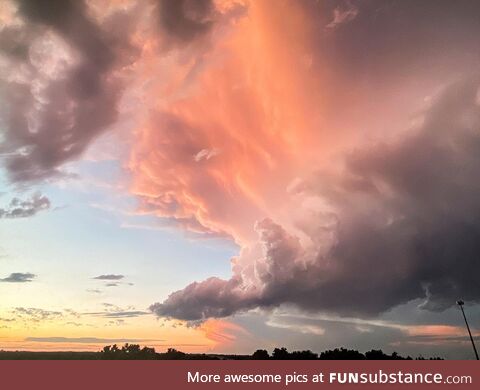 A massive cloud that looks like one of those classic landscape paintings