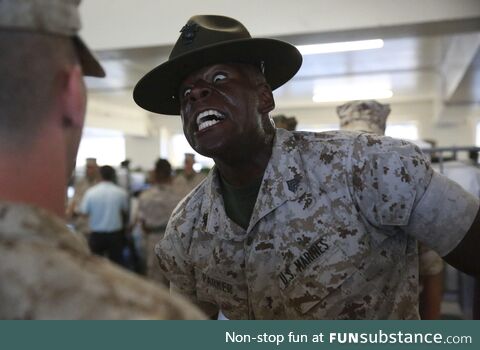 USMC Drill Instructor being nice to a new recruit during inspection