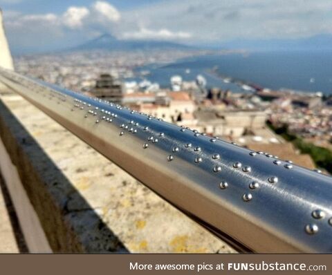 This railing on gazebo in Naples, Italy has braille describing the view for blind people