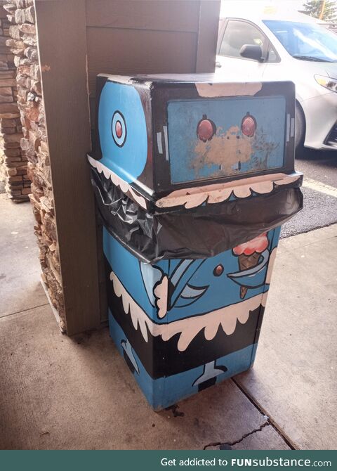 A trash can painted to look like Rosie from The Jetsons