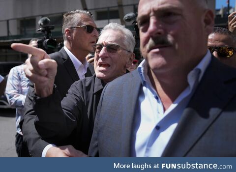 Robert De Niro, center, argues with a Donald Trump supporter