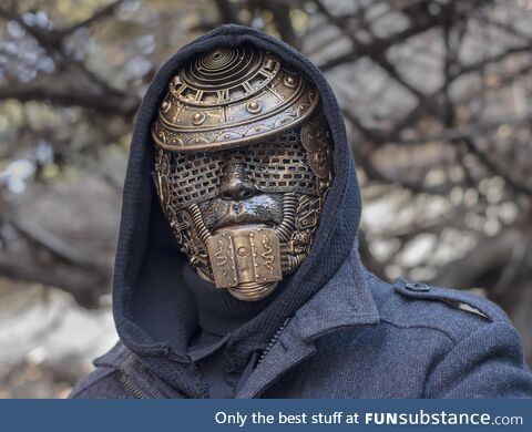 Parts of children's toys, gears from table clocks were used to decorate this mask