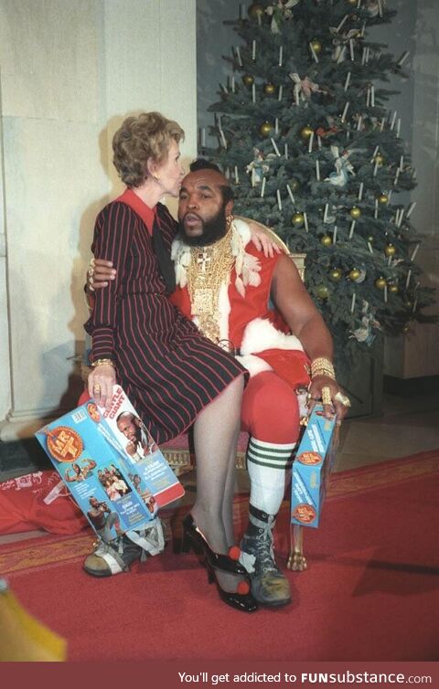 First Lady Nancy Reagan celebrating Christmas with Mr. T in 1983