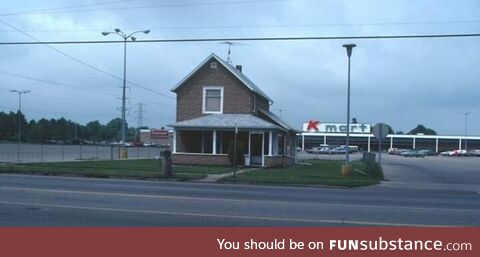 An old house in front of K-Mart in Lansing, MI back in 1970s