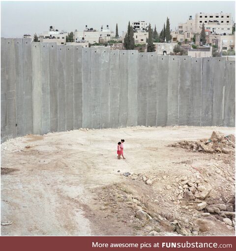 Palestinian kids next to the Separation Wall. Abu Dis, Palestine. 2004