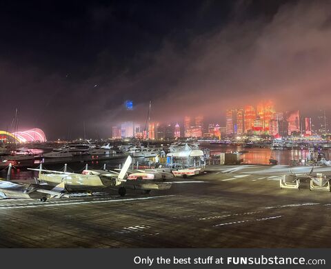 Qingdao: The clouds create a perfect scenery with the building lights behind