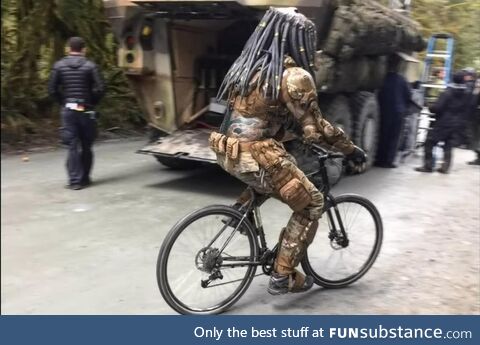 Predator riding a bicycle