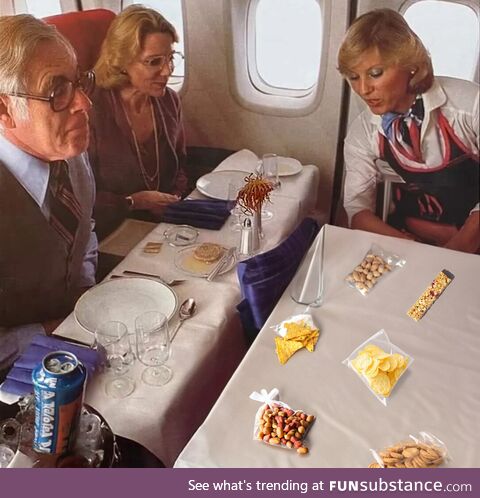 United Airlines flight attendant presents current First Class food offerings on a