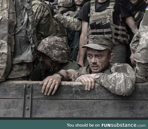 Exhausted, tired but unbroken. Ukrainian troops. Beautiful photograph