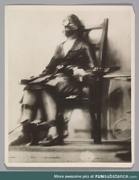 The first picture of the electric chair being used on a person. Her name was Ruth Snyder