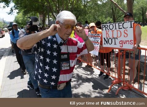 Man with An American flag shirt, reaction to kids protesting gun violence in their