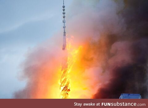 Copenhagen's stock exchange spire on fire, shortly before its collapse