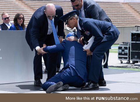 Biden being helped up after falling at the US Air Force Academy graduation ceremony