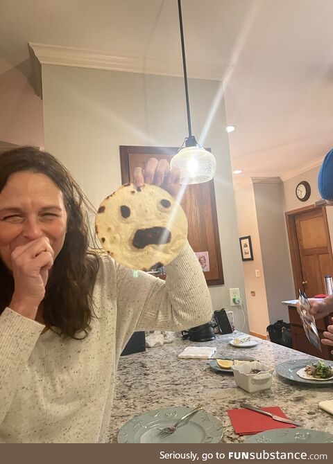 We accidentally burnt a tortilla and it looks horrified