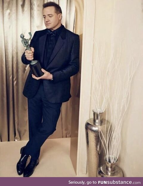 Brendan Fraser posing with his SAG award. Taken from his IG