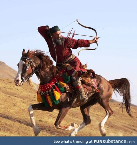 Ali Ghoorchian, an Iranian world-champion horseback archer, performs the famous Parthian