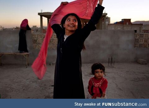 Yemeni child smiling after she was granted a divorce from her adult husband