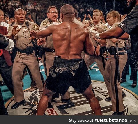 Las Vegas police trying to hold off Mike Tyson after he just bit off Evander