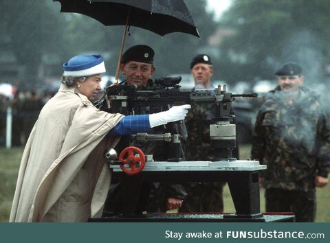 Queen Elizabeth II firing a British Assault Rifle