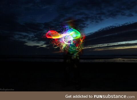 Making light jelly fish at the beach. Long exposure picture of an LED light whip