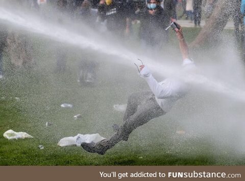 Man protesting Covid restrictions in Belgium hit by water cannon