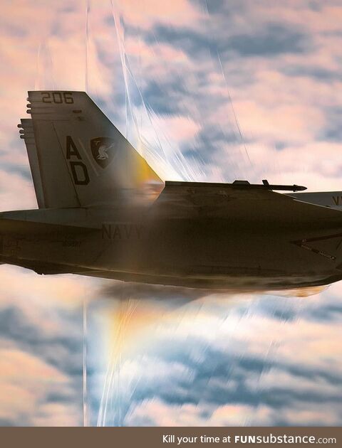 A Navy fighter jet approaches the speed of sound