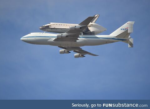 Space shuttle Endeavor on its final flight, shot from NAS Moffett Field