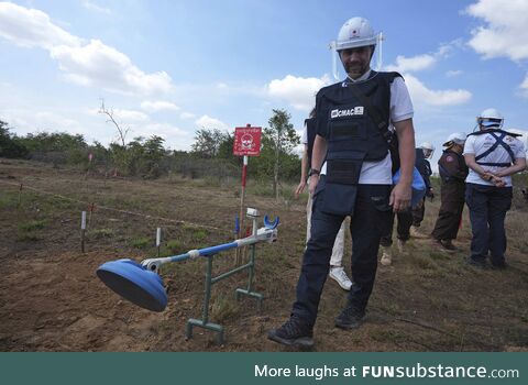 A Ukrainian soldier learning demining techniques from Cambodian experts in Cambodia