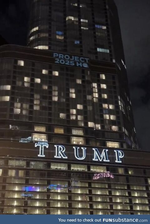 The DNC projects “Project 2025 HQ” onto Trump Tower in downtown Chicago on the eve of