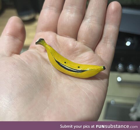 Tiny hand-carved banana character