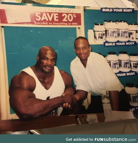 Ronnie Coleman next to a regular sized man