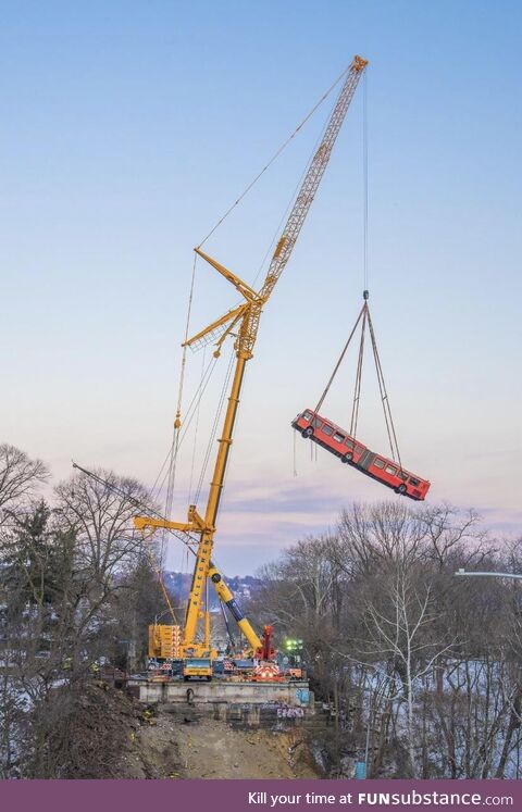 A bus being lifted off of a collapsed bridge in Pittsburgh. Credit to Dave DiCello
