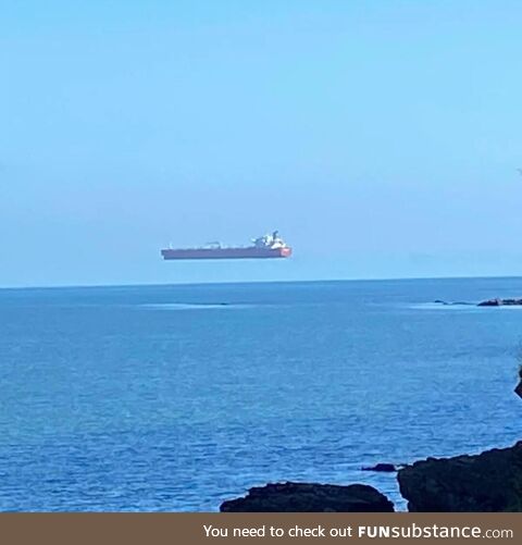 This levitating ship is an example of an optical illusion known as a superior mirage